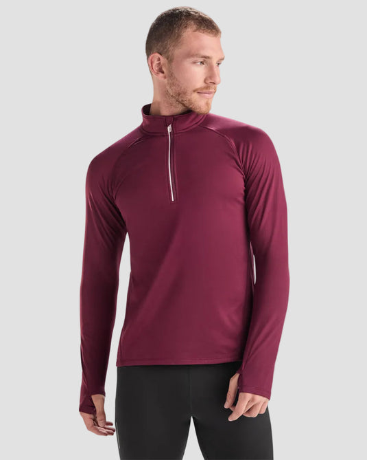 Man wearing a maroon long-sleeve athletic shirt on a white background