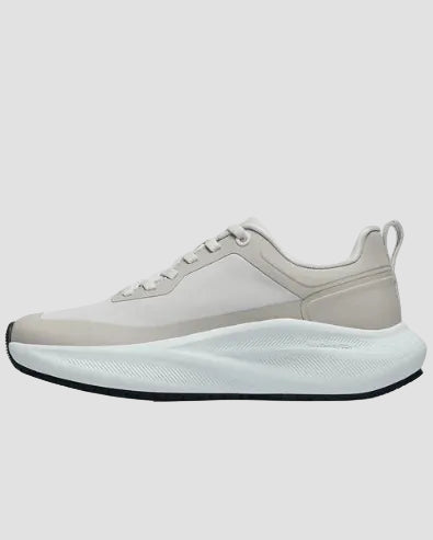 White athletic shoe on a light gray background