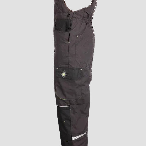 Dark gray work bib overalls with black cargo pockets and reflective details, shown from a side profile view on a white background.